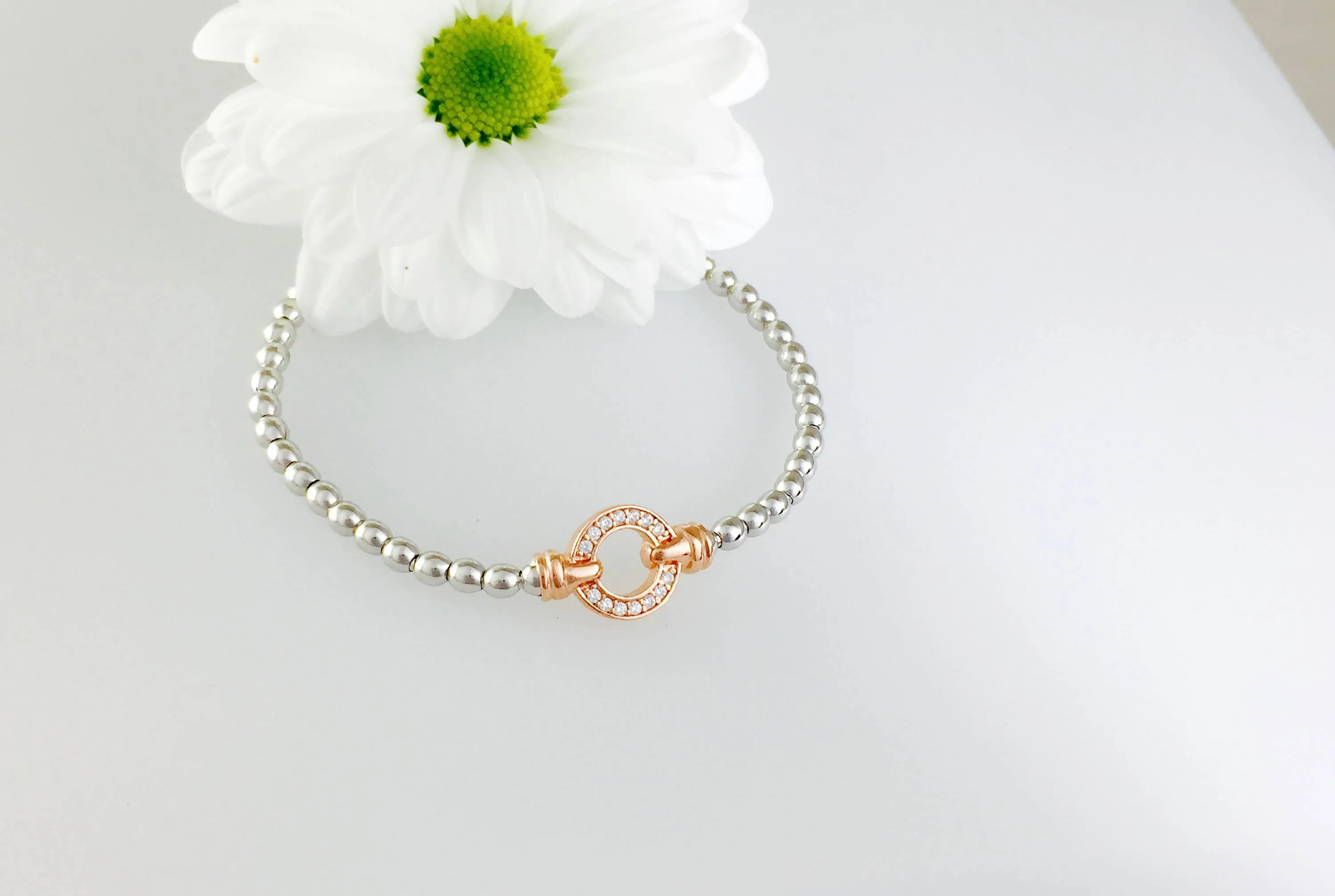Exquisite Silver Designer Circle Bracelet.  Rose gold pave set circle.