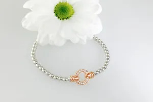 Exquisite Silver Designer Circle Bracelet.  Rose gold pave set circle.